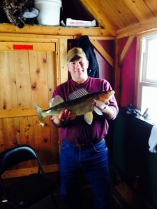 2014 Man in red shirt shows fish