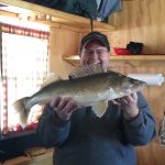 man shows big caught fish